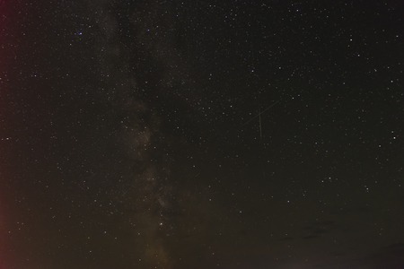 Photo two falling stars and of Milky Way in the beautiful starry sky