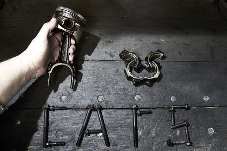 The inscription I love cars laid out from the details on the old desktop in the garage, hand of a...