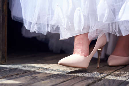 The bride's shoes, the bride took off her shoes because she was tired, wedding day.の写真素材