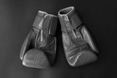 Leather boxing gloves, top view, black and white photo.の写真素材