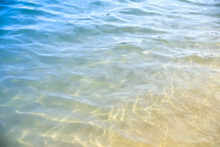 Transparent calm sea surface on a sunny day, summer background.の写真素材