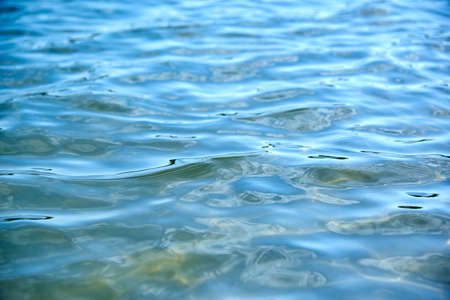 Transparent calm sea surface on a sunny day, summer background.の写真素材