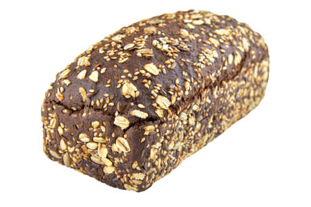 Dark rye bread with whole sunflower seeds, flaxseeds and oatmeal on top isolated on white background.の写真素材