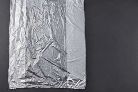 Three plastic bag on dark background, environmental pollution concept.の写真素材