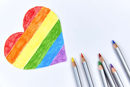 Paper heart painted in LGBT colors with pencils on a light background.の写真素材