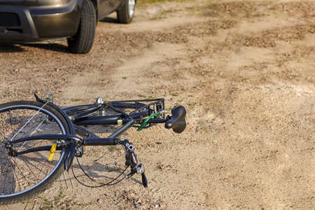 Photo of car and bicycle on the road, the concept of road accidents, copy space.の写真素材