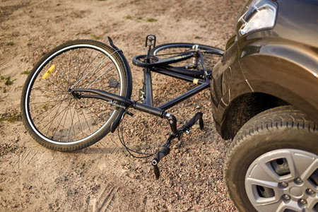 Photo of car and bicycle on the road, the concept of road accidents.の写真素材