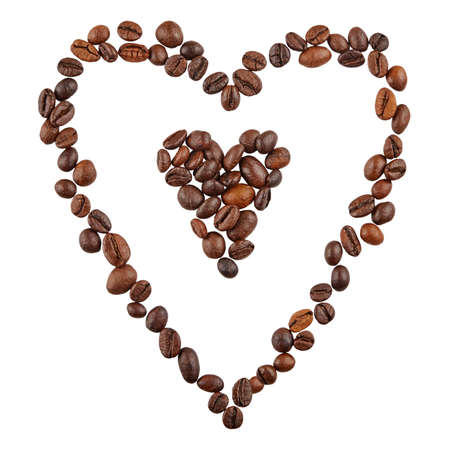 Two hearts shaped coffee beans isolated on white background.の写真素材