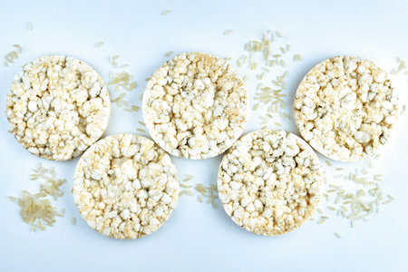 Rice round crispbread and grains of rice, top view.の写真素材
