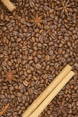 Star anise and cinnamon lie on coffee beans, copy space, toned photo.の写真素材