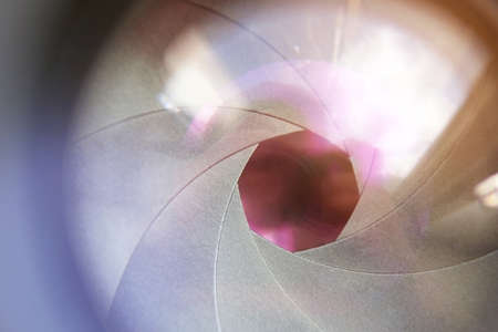 Photo of camera lens aperture, close-up, macro, backdrop.