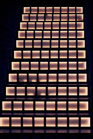 Modern steps with bright night lighting, creative background.の写真素材