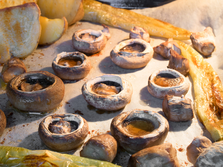 mushrooms, potatoes and green peppers cooked in the ovenの写真素材