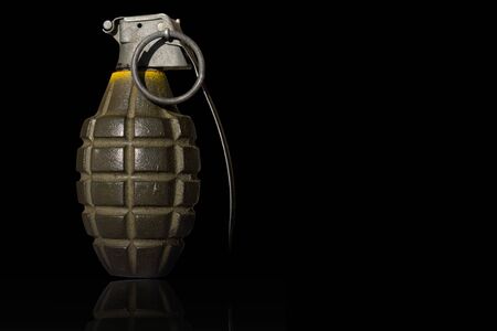 isolated hand bomb with black backgroundの写真素材