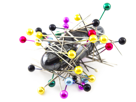 needles with magnet on white backgroundの写真素材