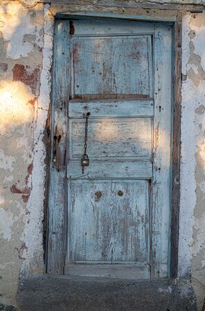 old paint deformed village house doorの写真素材