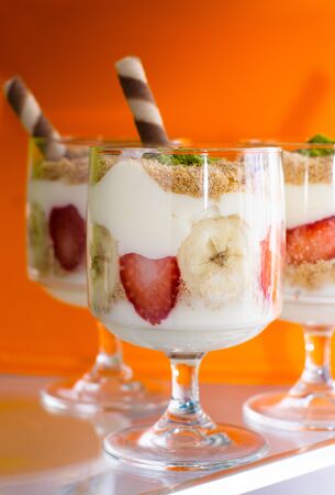 magnolia dessert with glass in refrigerator and orange backgroundの写真素材