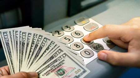 withdrawal process dollar and password entry from bank atm