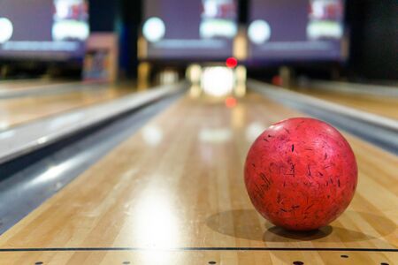 red bowling ball and blur background in bowling playgroundの写真素材
