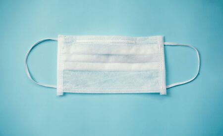 Protective face mask on blue