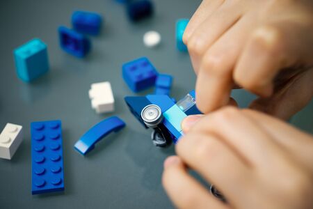 child joining toy blocks with small piecesの写真素材
