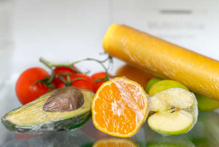to keep vegetables and fruits fresh with stretch film in the refrigeratorの写真素材