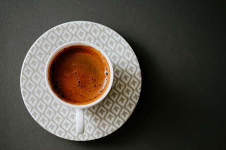 Turkish coffee with plenty of foam in a small cupの写真素材