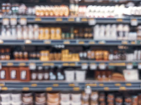 shelves of food and food products in super market on blurred backgroundの写真素材