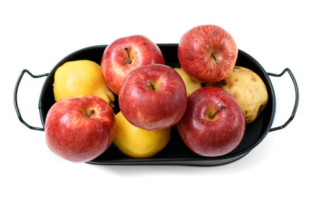 apple, pear, quince in black orchard with white isolated backgroundの写真素材