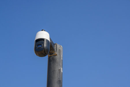 Security camera on pole in city center