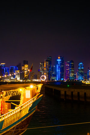 View of seaside tour boat and buildings in the corniche area of ââDoha, Qatarの写真素材