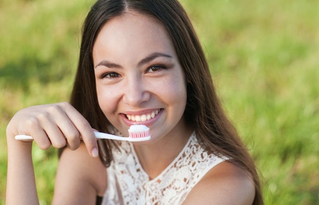 Beautiful pregnant lady holding toothbrush の写真素材