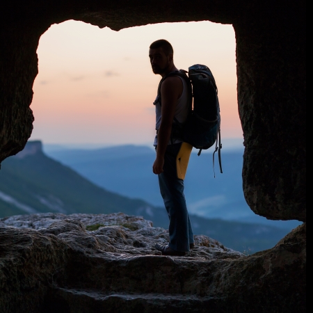 Silhouette of man with backpack in cave  Crimea の写真素材