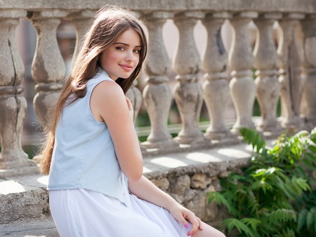 Portrait of a beautiful young girl looking at the camera の写真素材