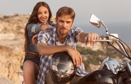 Biker man and girl sitsの写真素材