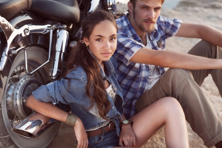 Biker man and girl sitsの写真素材