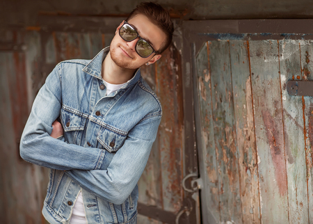 handsome guy with glasses and a fashionable hairdo. vintage photoの写真素材