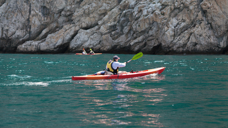 Kayak  People kayaking in the oceanの写真素材