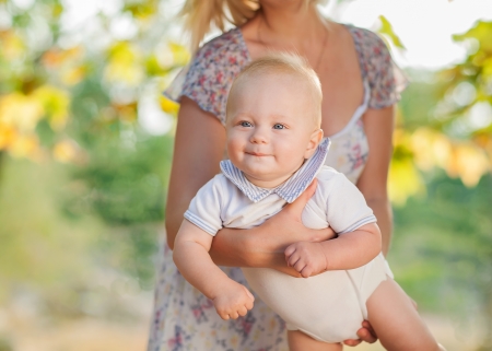 Happiness Baby on the mother handsの写真素材