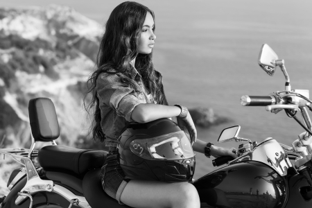 Black and white photo  Biker girl sits on a motorcycle の写真素材