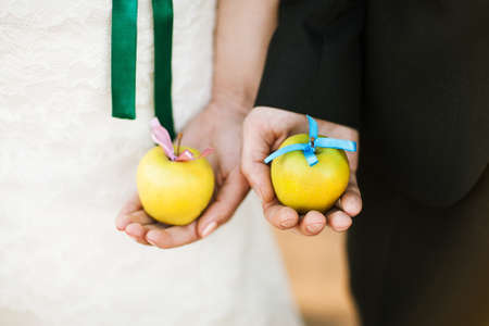apple in the hands of the marriedの写真素材