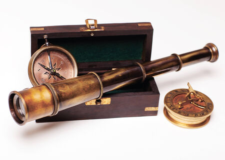 spyglass and compass isolated on white. 3d rendered image. navigation conceptの写真素材