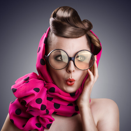 sexy retro woman in big glasses and skarfの写真素材