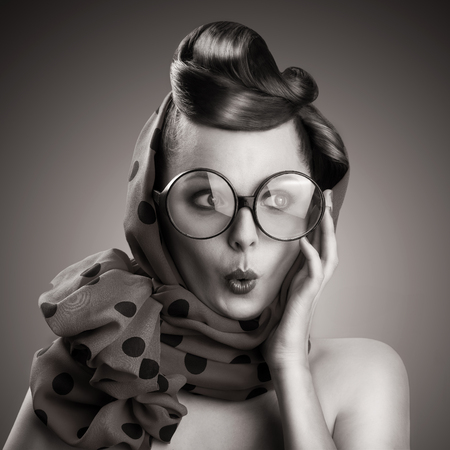 sexy retro woman in big glasses and skarf, black and whiteの写真素材