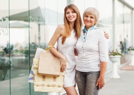 Adult mother and daughter after shopping の写真素材