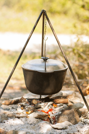 tourist cauldron is jut cooking in Cauldron on Campfireの写真素材