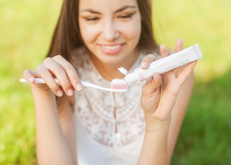 Image of pretty female brushing her teeth の写真素材
