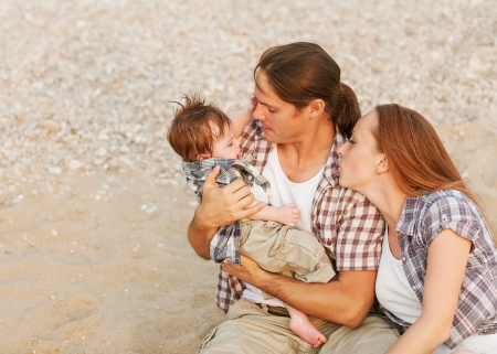 parents soothe a crying babyの写真素材