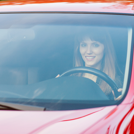 Pretty girl in a car の写真素材
