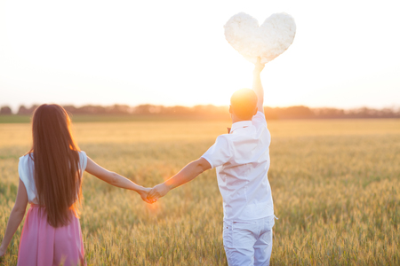 couple in love holding a heartの写真素材